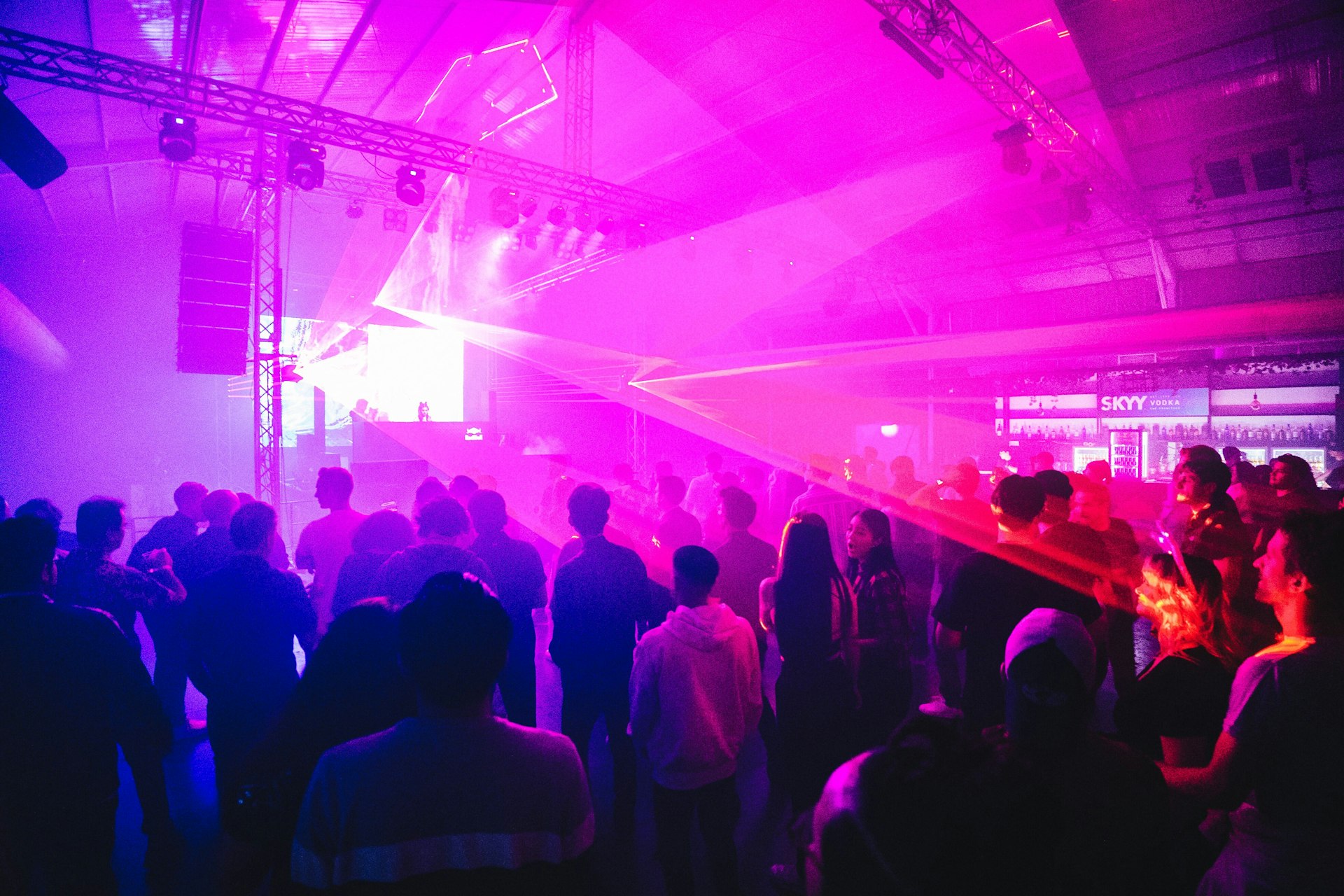 a crowd of people standing around a stage